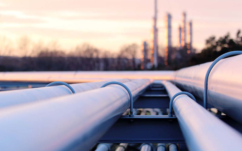 steel long pipes in crude oil factory during sunset Business Strategy & Innovation